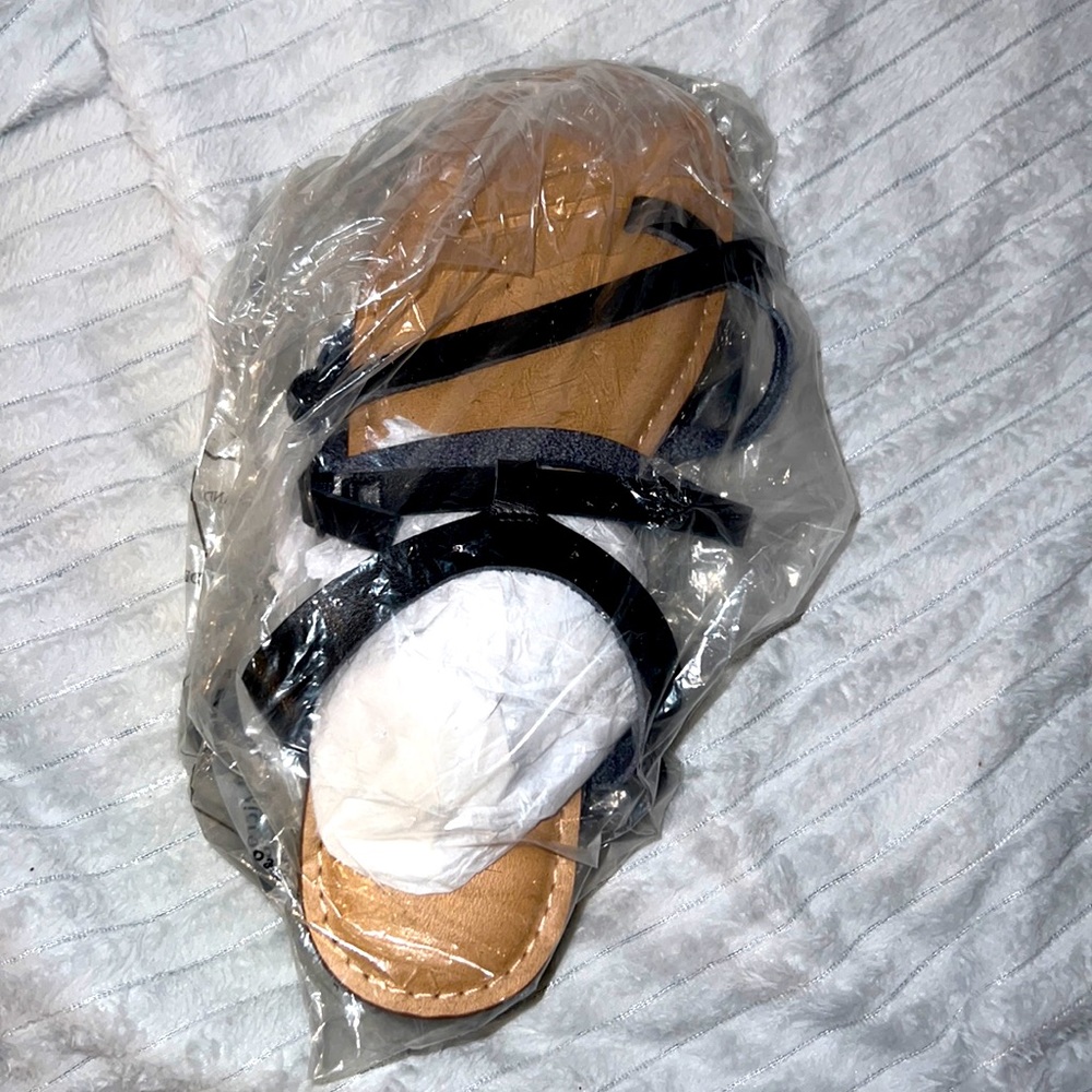 Torrid black leather brown bottom flat sandals, never worn, size 11WW